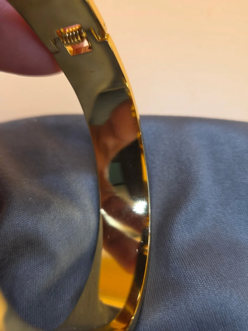 Tory Burch black and gold-tone resin cuff bracelet featuring a pavé crystal-embe